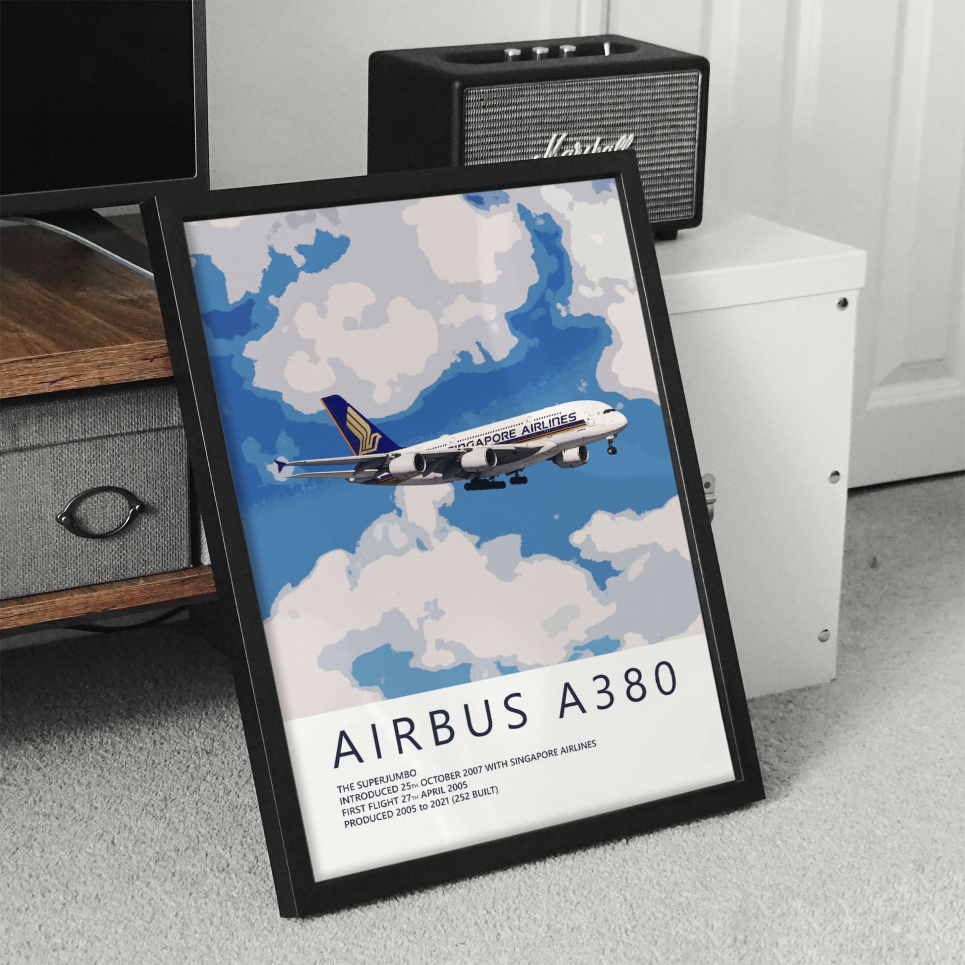 an Airbus A380 airplane flying in the sky, with a framed poster or artwork displaying the airplane and its surroundings.
